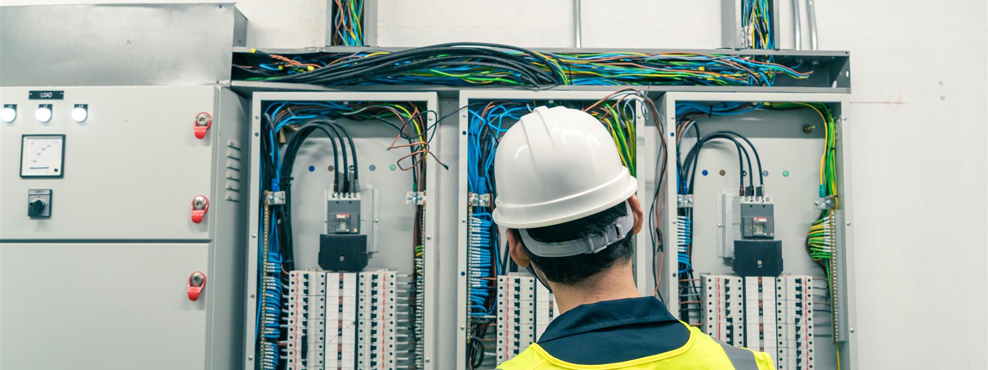 electrical contractors working on electric board